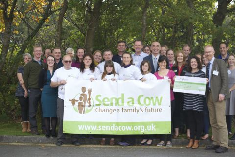 Handing the cheque over to Send a Cow