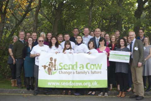 Handing over the cheque to Send a Cow